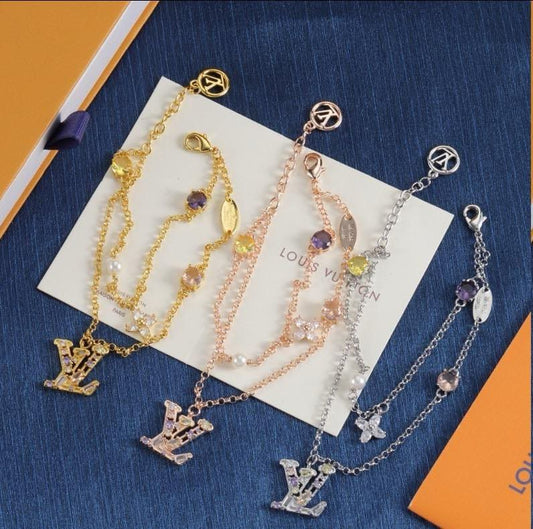 L. V. Layered Charm Necklace
