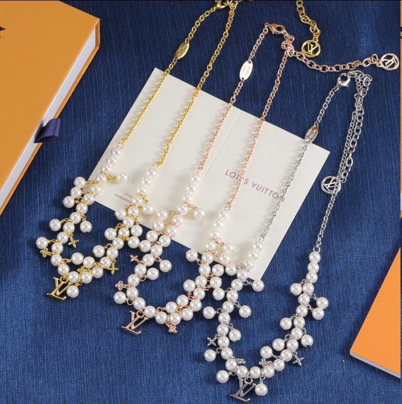 L. V. Pearl Necklaces